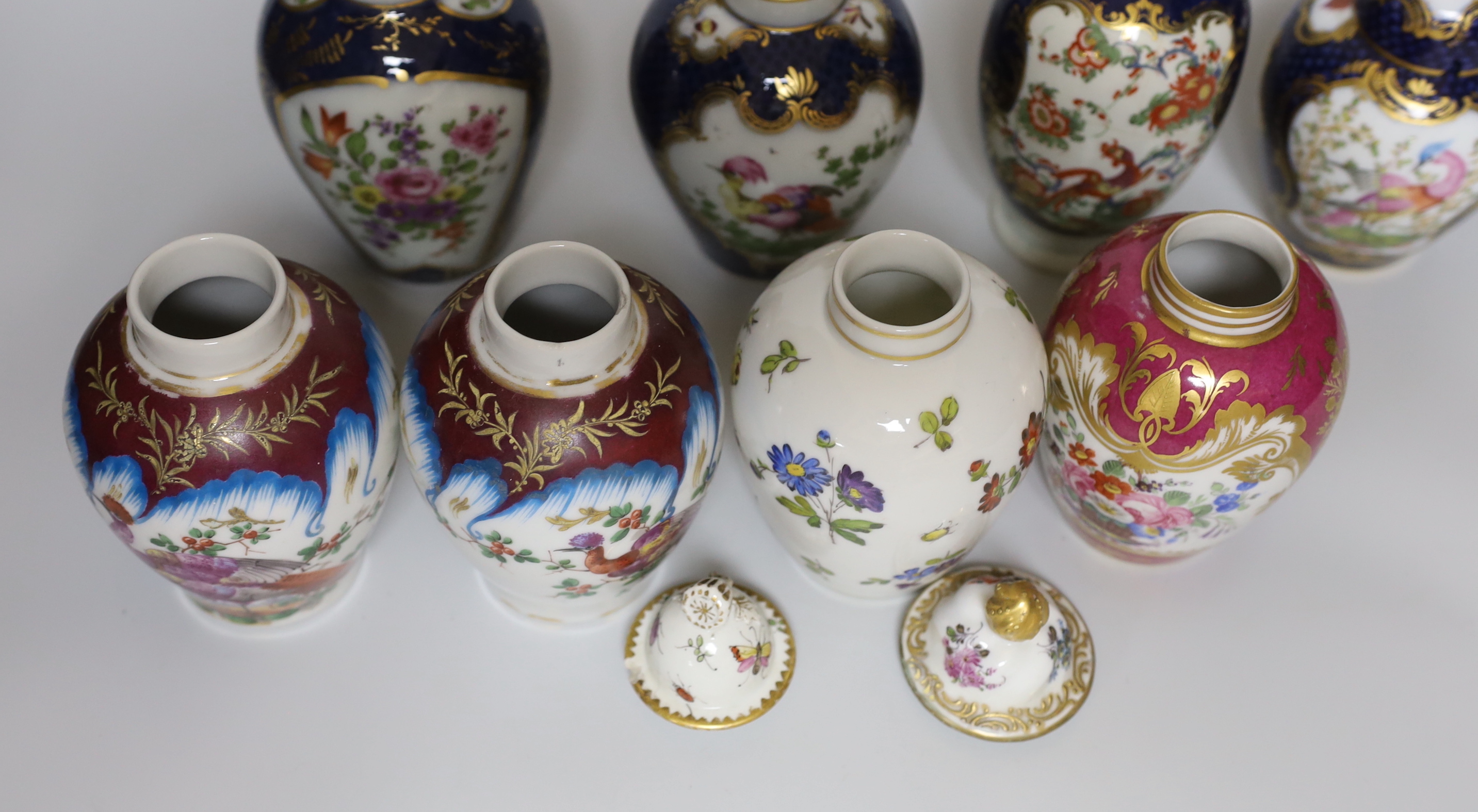 A group of Paris porcelain tea canisters in imitation of Worcester and Sevres, tallest 13.5cm, together with a Worcester Kakiemon pattern scale blue tea canister a/f